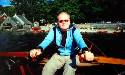 Peter Cropper on a rowing boat in the Lakes